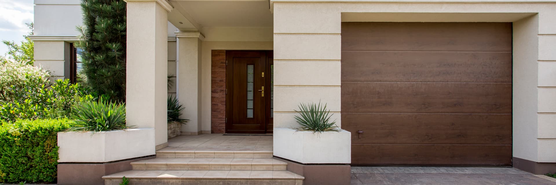 Composite garage door replacement with modern panels in southern New Hampshire